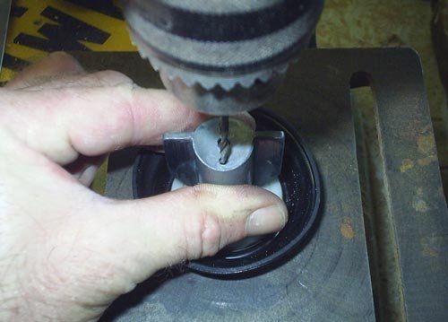 Enlarging the vacuum hole using a pillar drill